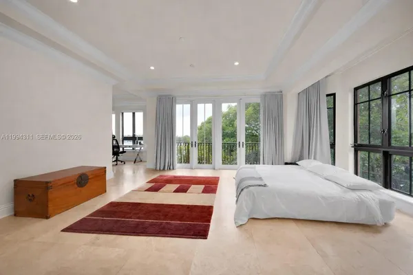 a bathroom with a granite countertop sink mirror and toilet