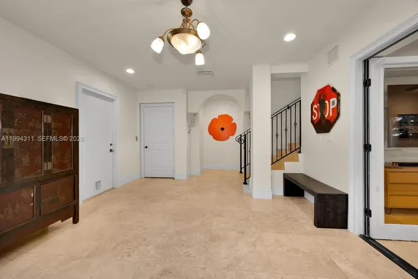 a view of an empty room with a fan