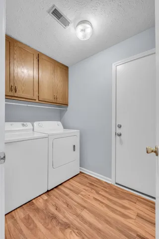 a view of a room with gym equipment and a window