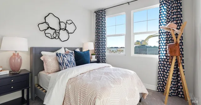 a bedroom with bed and a window