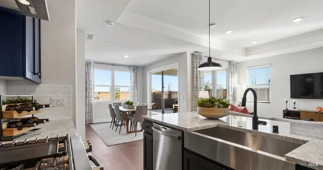 a kitchen with counter top space a sink cabinets and appliances