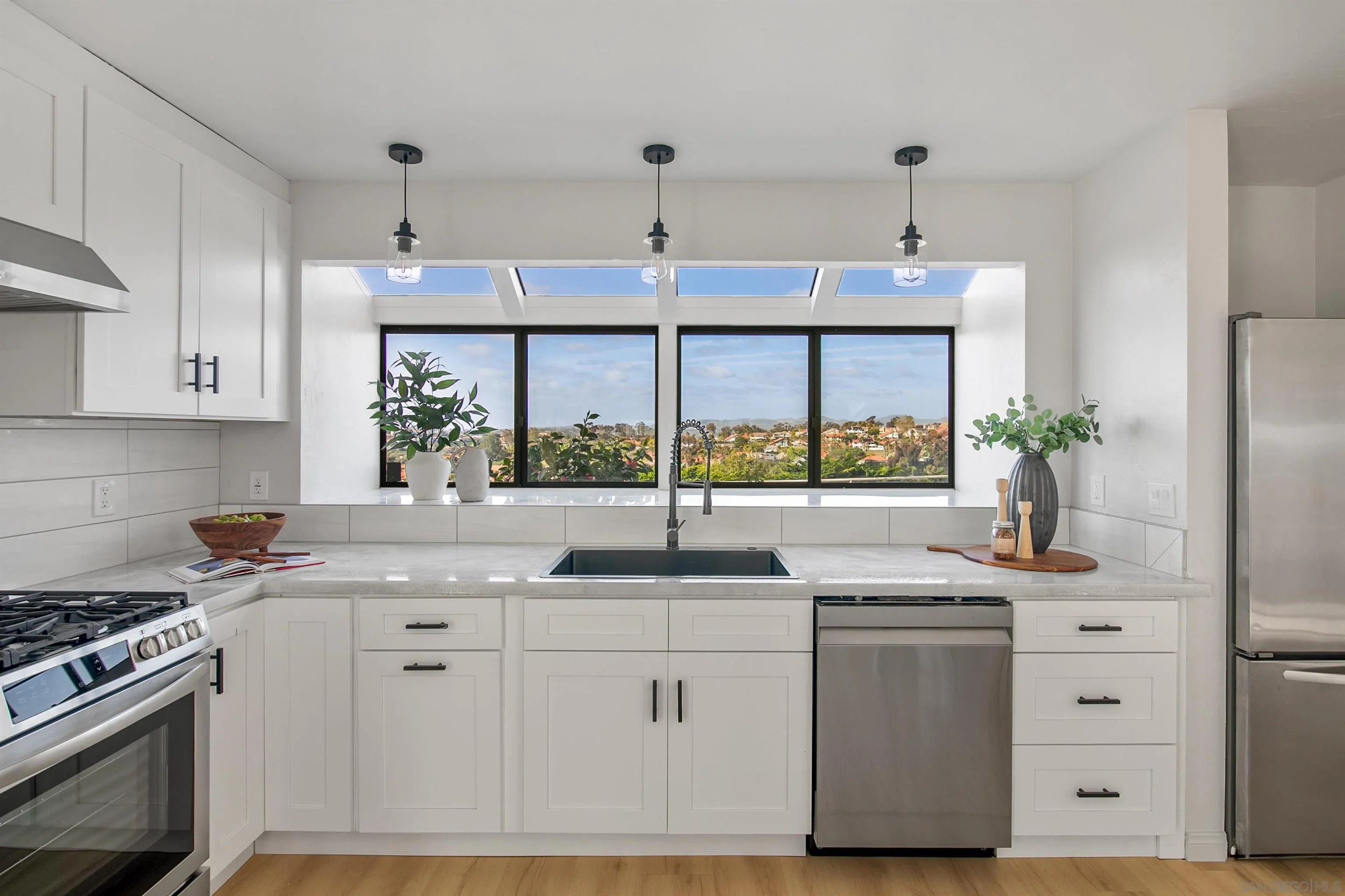1050 Solana Drive Del Mar, CA 92014 - Photo 17 of 75 a kitchen with stainless steel appliances granite countertop a sink stove and refrigerator
