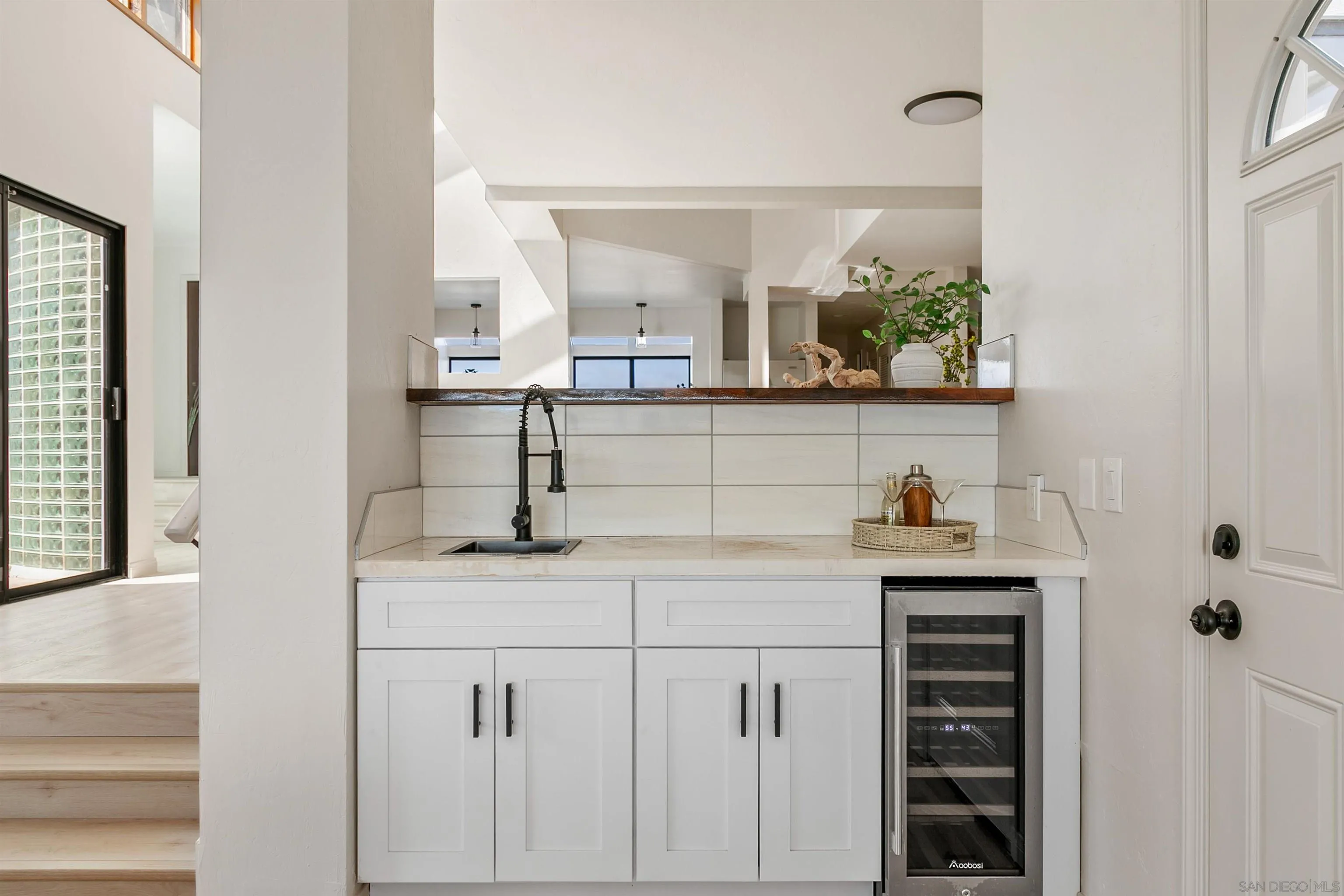 1050 Solana Drive Del Mar, CA 92014 - Photo 22 of 75 a kitchen with a sink and cabinets