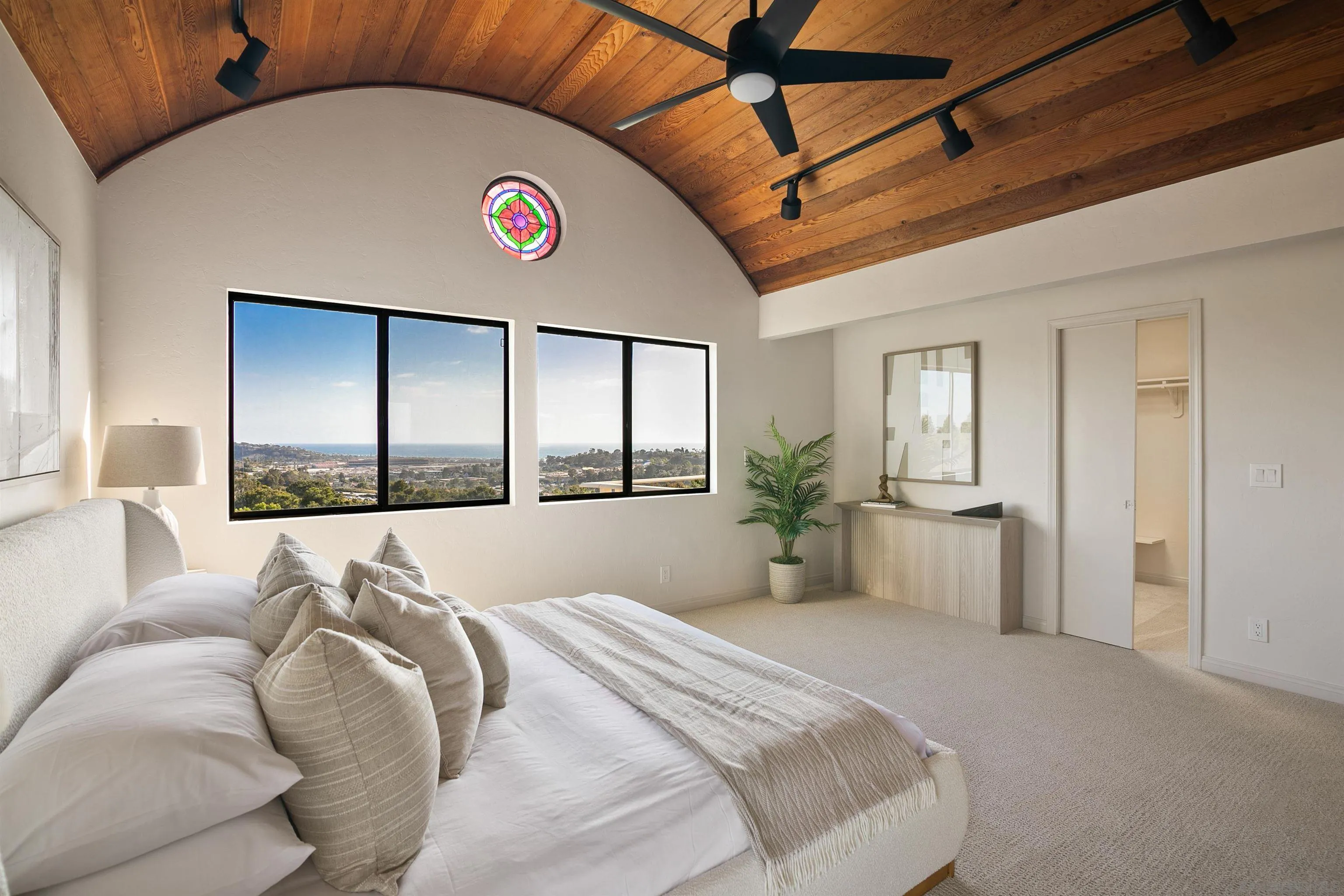 1050 Solana Drive Del Mar, CA 92014 - Photo 26 of 75 a bedroom with a bed and a large window