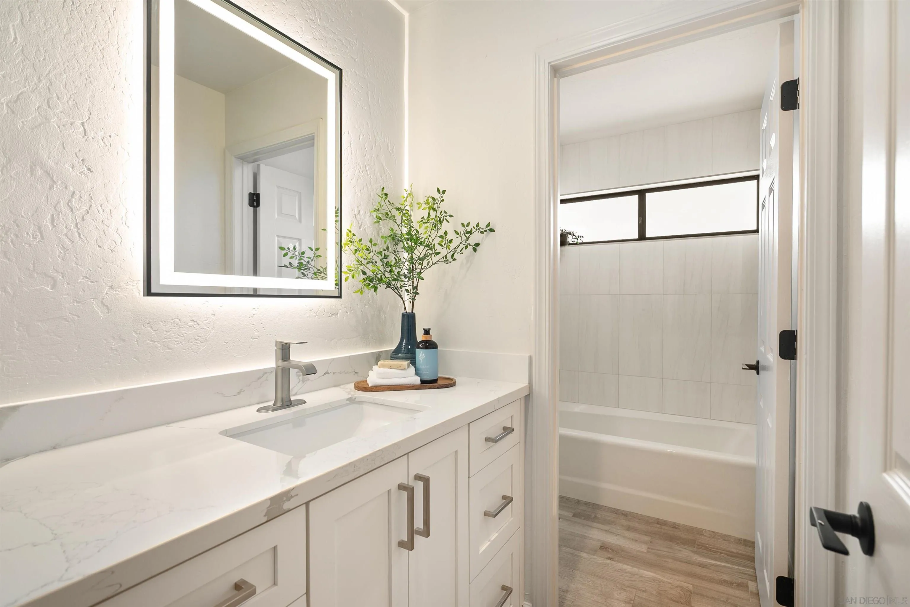 1050 Solana Drive Del Mar, CA 92014 - Photo 39 of 75 a bathroom with a sink and a mirror