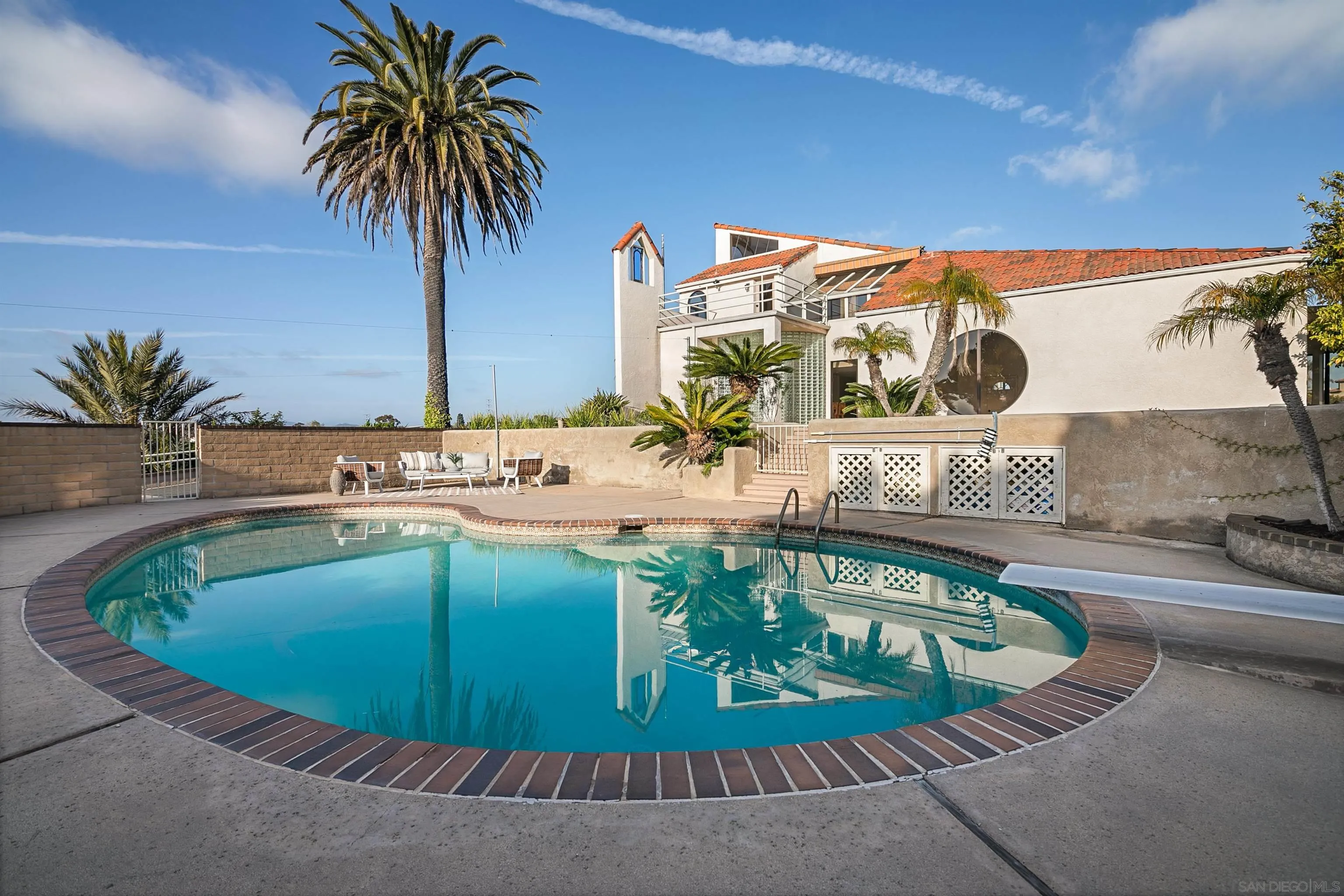 1050 Solana Drive Del Mar, CA 92014 - Photo 49 of 75 a view of a swimming pool with a sitting space