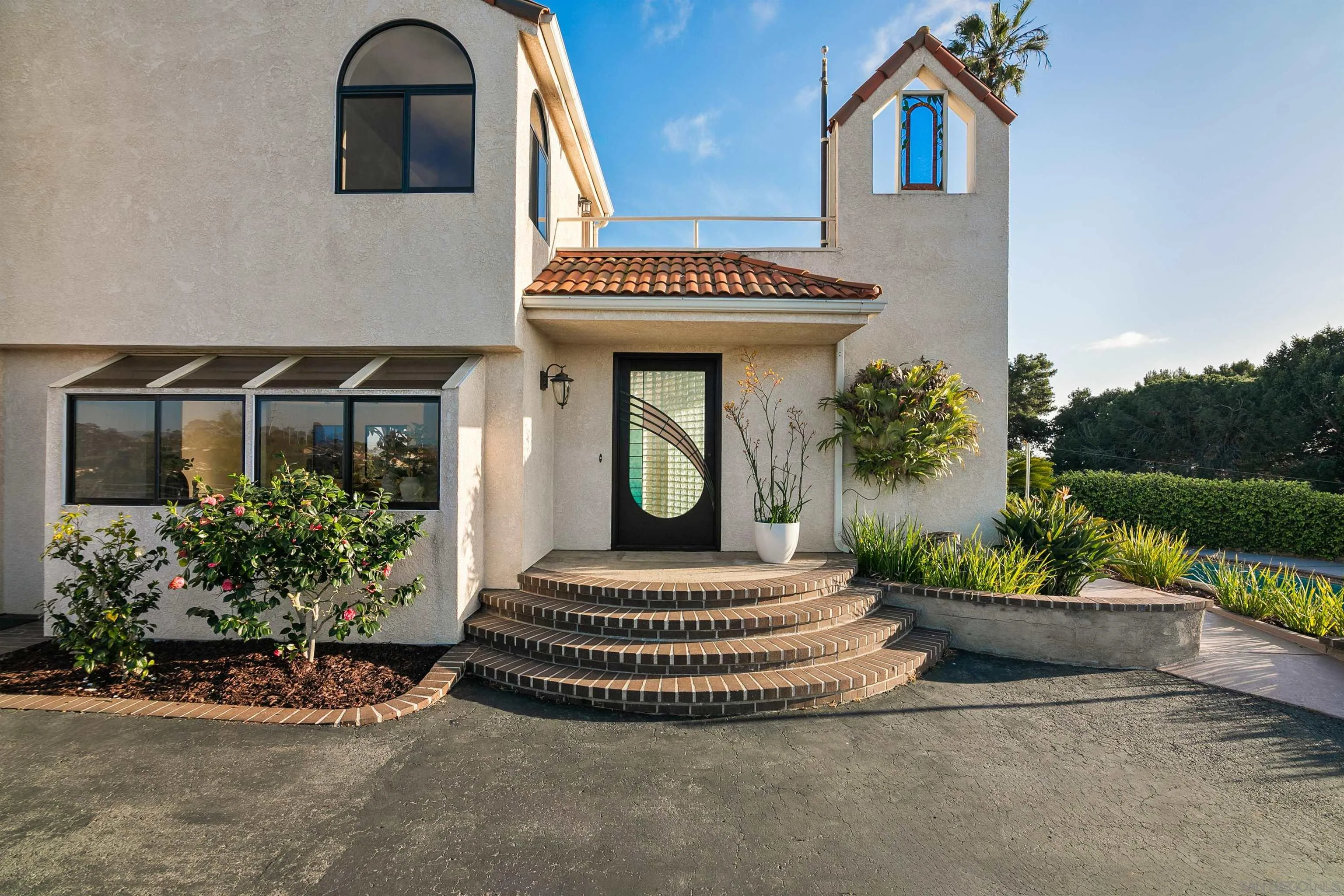 1050 Solana Drive Del Mar, CA 92014 - Photo 50 of 75 a front view of a house with garden