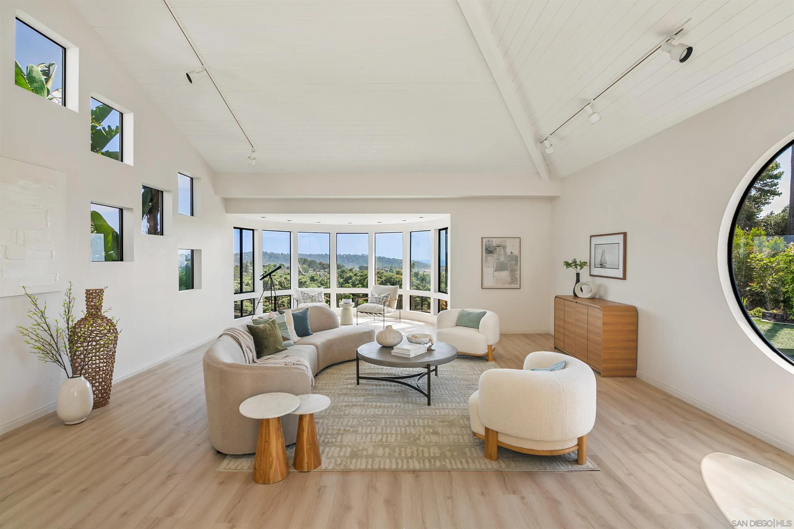 1050 Solana Drive Del Mar, CA 92014 - Photo 10 of 75 a living room with furniture and a large window
