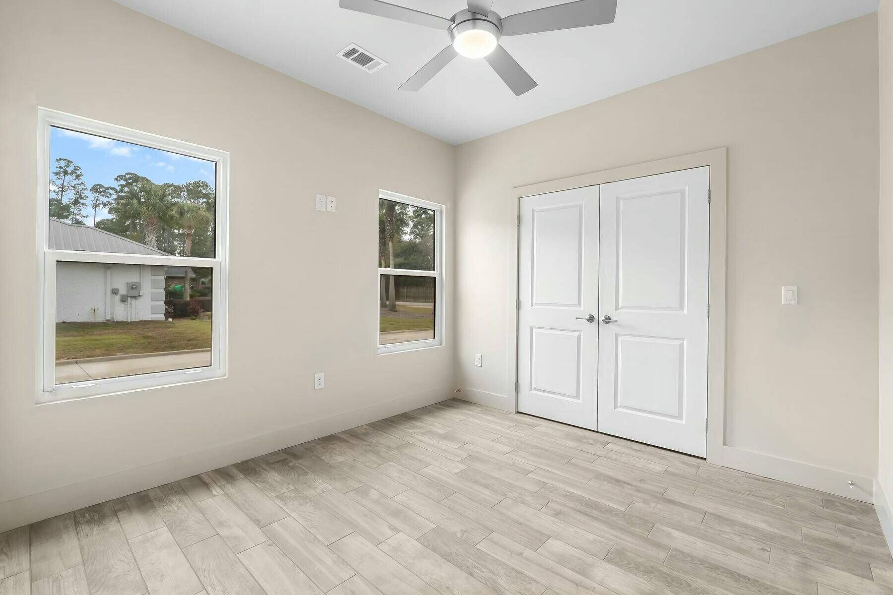 158 Driftwood Point Road Santa Rosa Beach, FL 32459 - Photo 13 of 24 a view of an empty room with a window and closet area