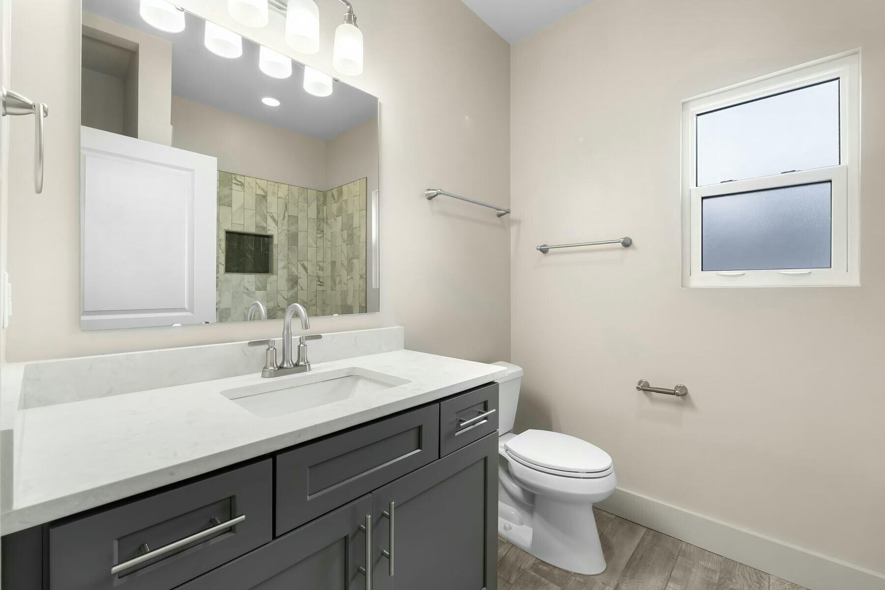 158 Driftwood Point Road Santa Rosa Beach, FL 32459 - Photo 14 of 24 a bathroom with a sink a toilet and mirror