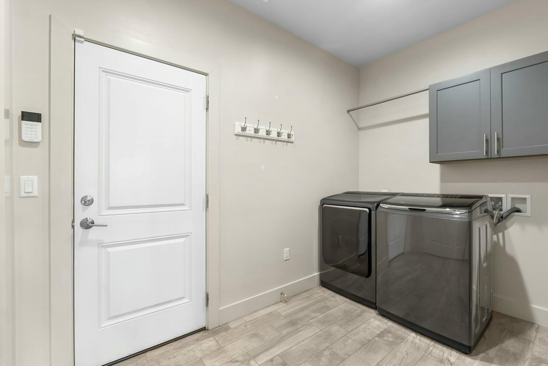 158 Driftwood Point Road Santa Rosa Beach, FL 32459 - Photo 17 of 24 a utility room with cabinets