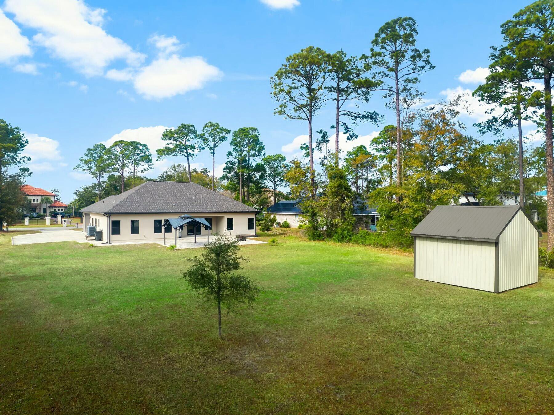 158 Driftwood Point Road Santa Rosa Beach, FL 32459 - Photo 19 of 24 a view of a house with a yard