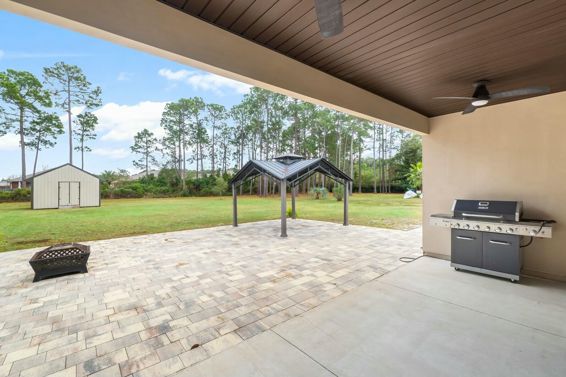 158 Driftwood Point Road Santa Rosa Beach, FL 32459 - Photo 22 of 24 a view of a porch with a yard