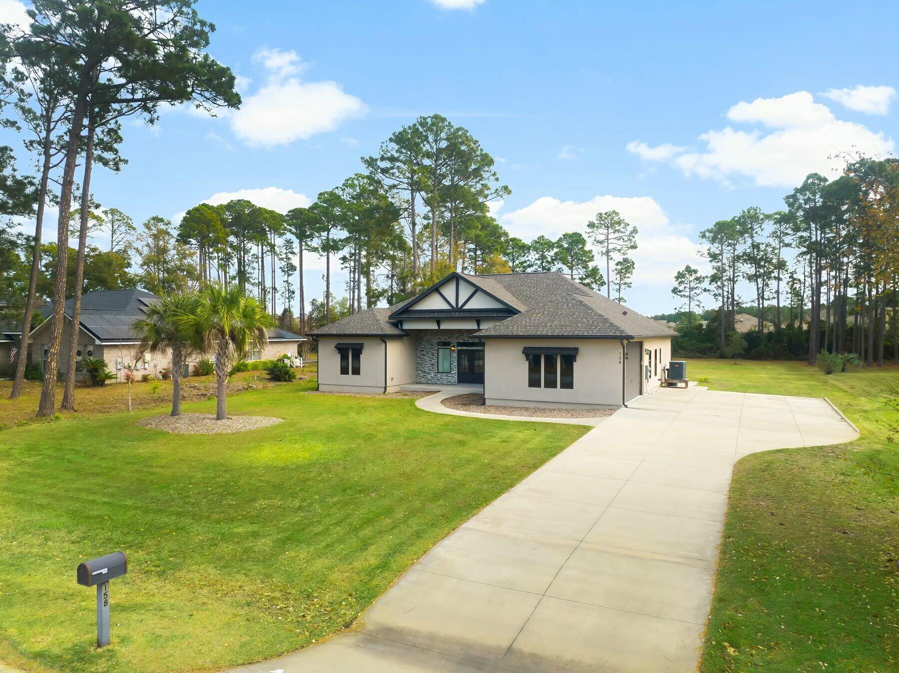 158 Driftwood Point Road Santa Rosa Beach, FL 32459 - Photo 24 of 24 a front view of a house with a yard