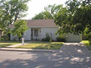 4312 Parker Street Amarillo, TX 79110 - Photo 1 of 1 a view of a house with a yard and large tree