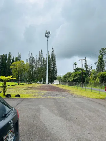 a view of a swimming pool and a yard