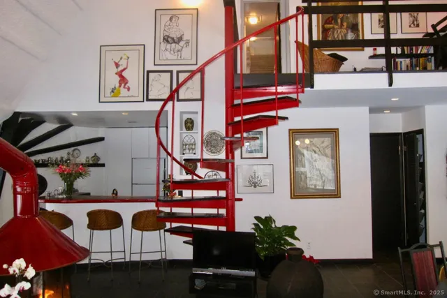 a room with furniture and a floor to ceiling window