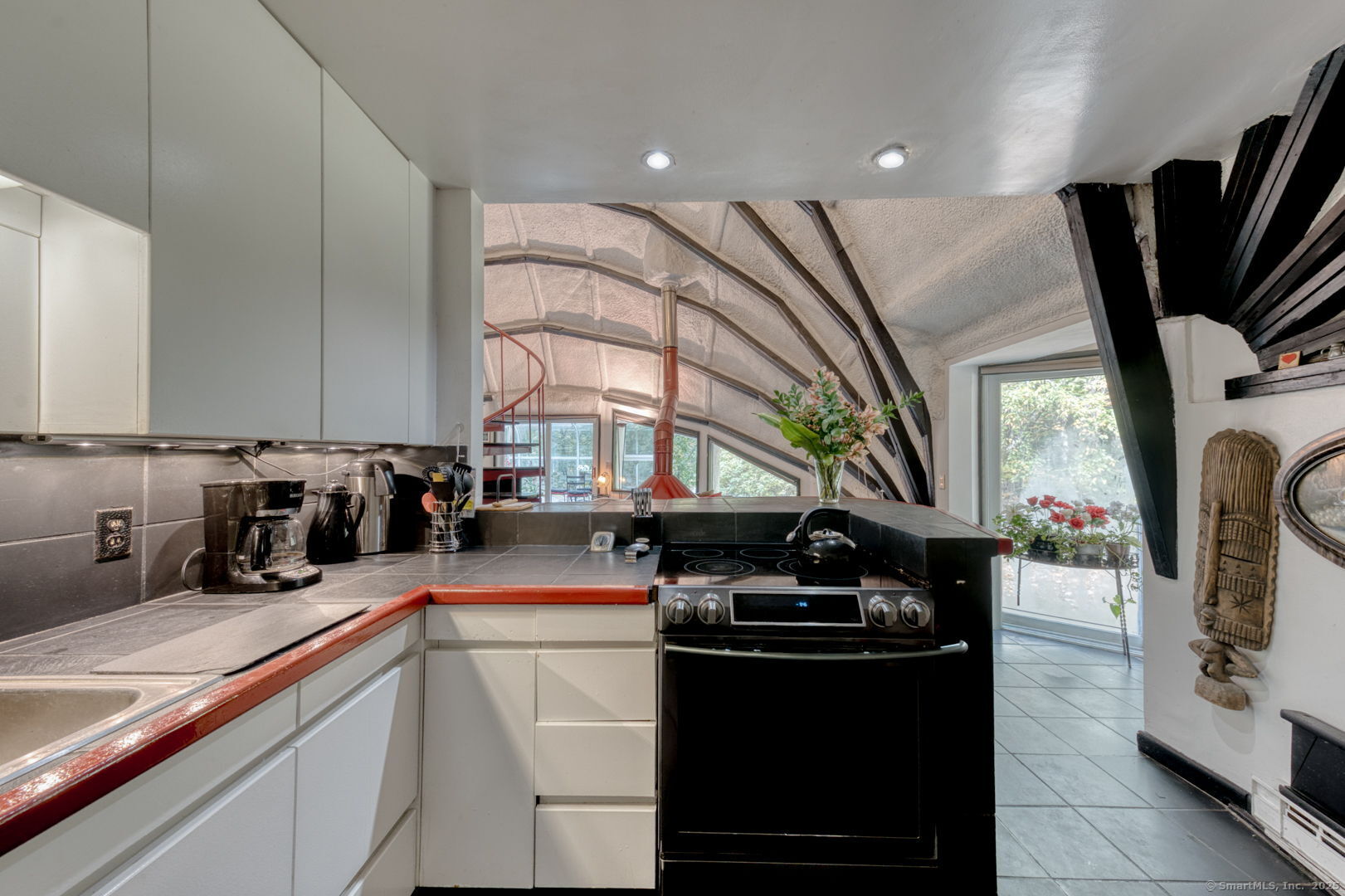 11 Day Road Cornwall, CT 06754 - Photo 17 of 40 a kitchen with stainless steel appliances kitchen island granite countertop a sink a stove and a wooden floors