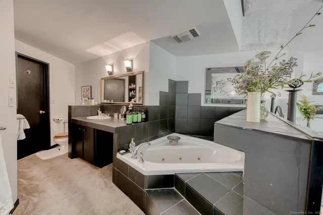 a kitchen with a sink and refrigerator