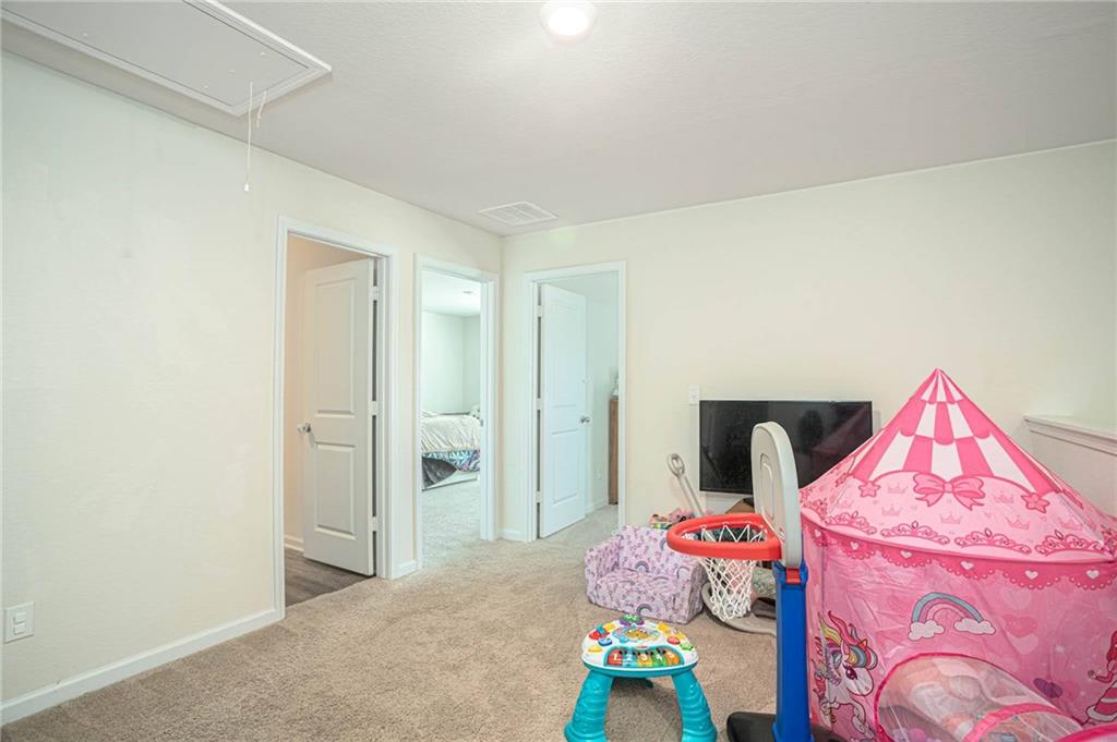 635 Meadows Farm Way Monroe, GA 30655 - Photo 19 of 36 a bedroom with a bed and hallway