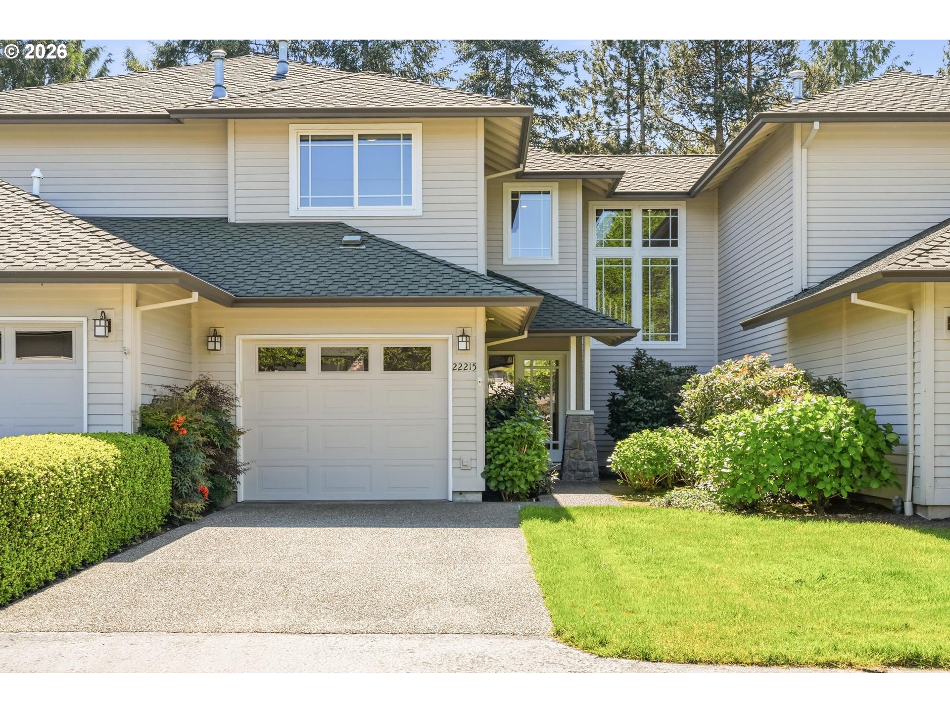 22215 Chelan Loop West Linn, OR 97068 - Photo 1 of 38 a front view of a house with garden