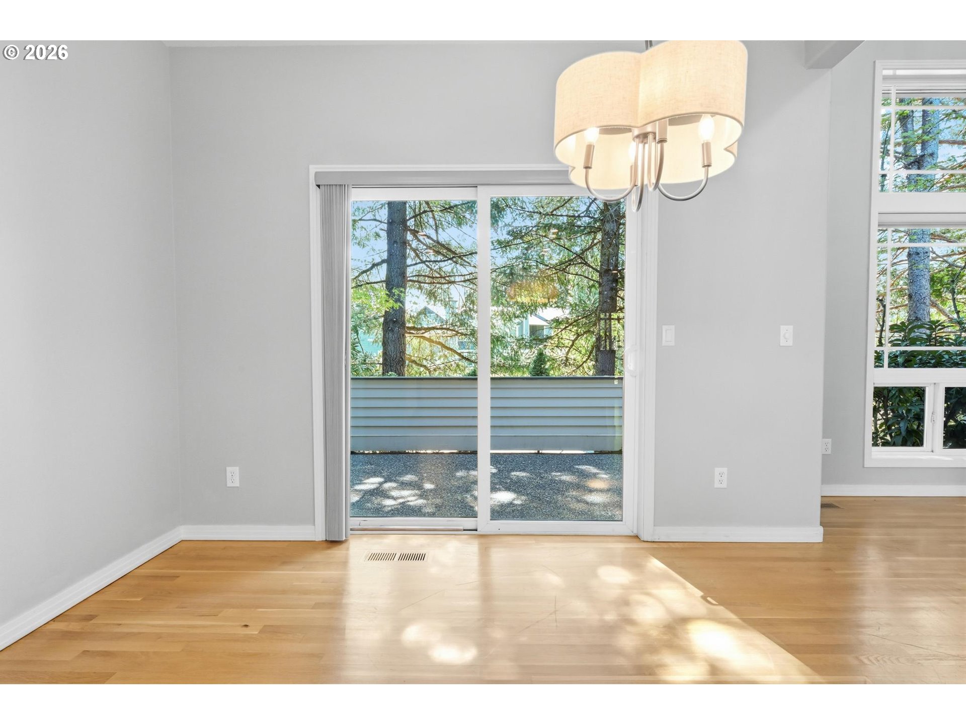 22215 Chelan Loop West Linn, OR 97068 - Photo 22 of 38 a view of empty room with wooden floor and fan