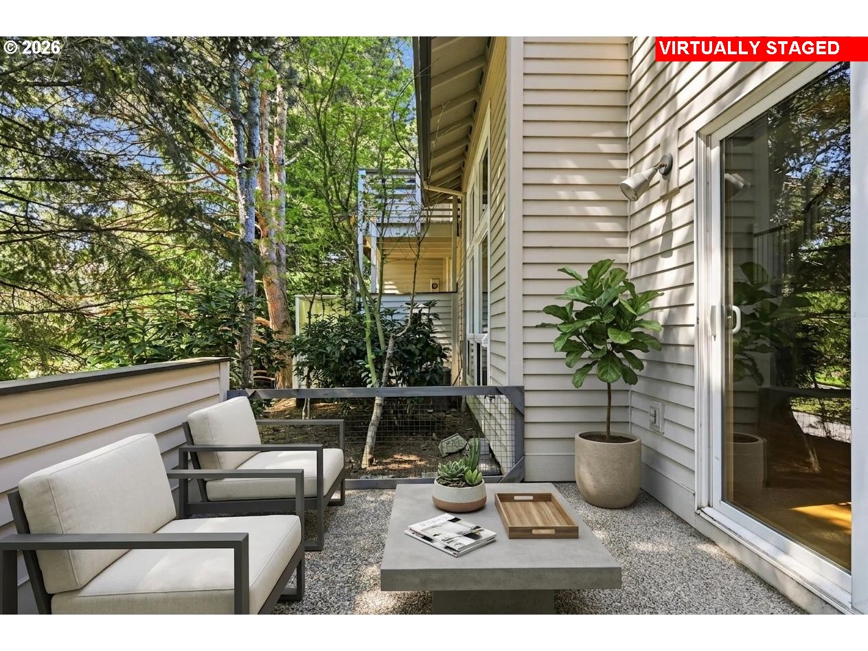 22215 Chelan Loop West Linn, OR 97068 - Photo 23 of 38 a view of a patio with couches and potted plants