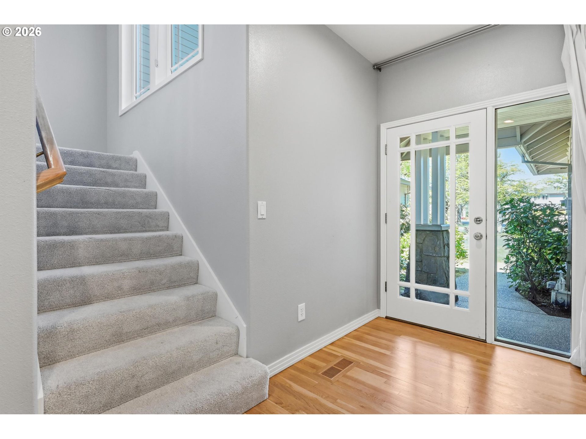 22215 Chelan Loop West Linn, OR 97068 - Photo 25 of 38 a view of an entryway with wooden floor and door