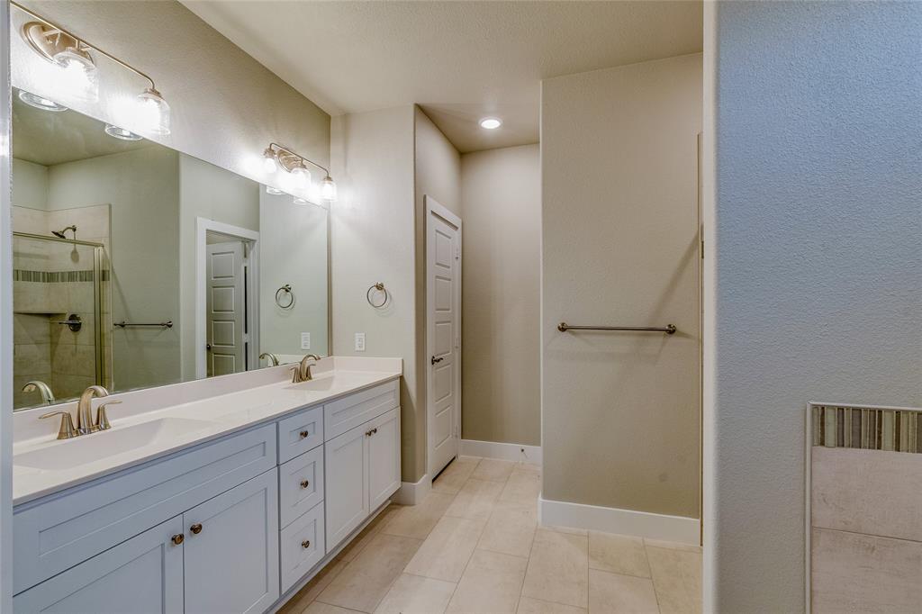 602 Kyle Drive Tioga, TX 76271 - Photo 19 of 29 a spacious bathroom with a double vanity sink mirror and double