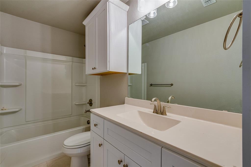 602 Kyle Drive Tioga, TX 76271 - Photo 25 of 29 a bathroom with a sink a toilet and shower