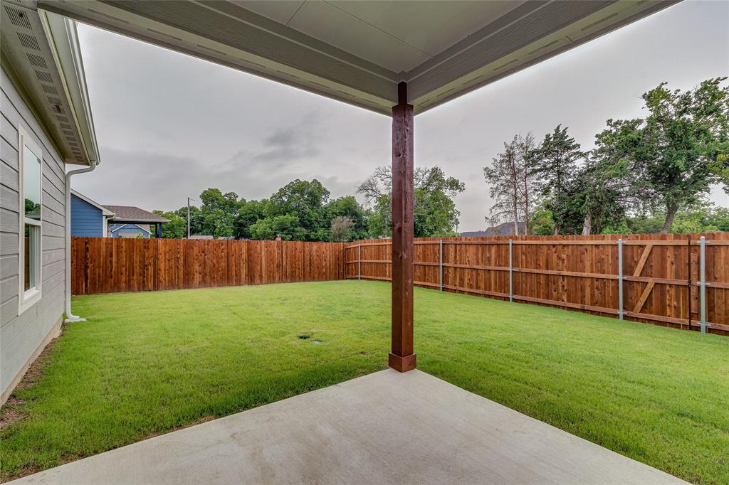 602 Kyle Drive Tioga, TX 76271 - Photo 27 of 29 a view of a backyard with a garden