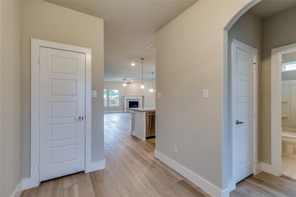 602 Kyle Drive Tioga, TX 76271 - Photo 4 of 29 a view of a hallway with wooden floor and closet area