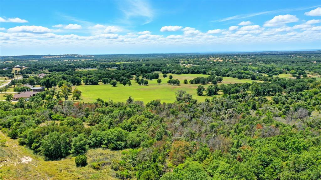 395 Pepper Lane Weatherford, TX 76088 - Photo 12 of 24 Drone / aerial view of a heavily wooded area