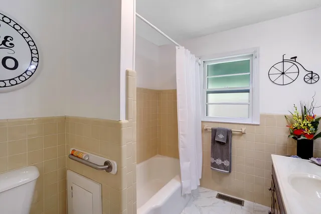 a bathroom with a toilet a sink and a bathtub