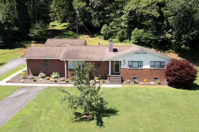 a front view of a house with table and chairs