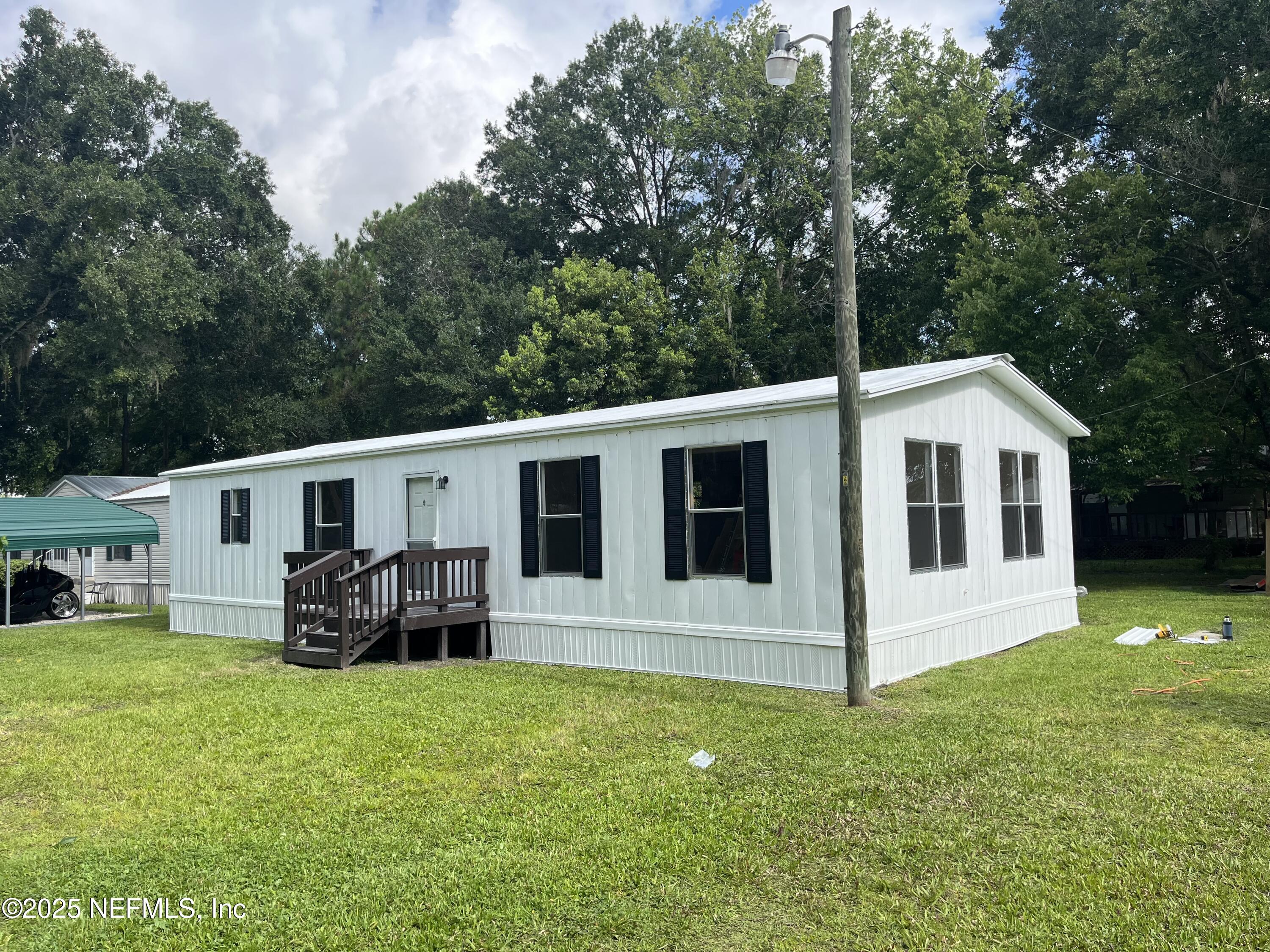 1193 Crum Street Starke, FL 32091 - Photo 3 of 10 a front view of house with yard and green space