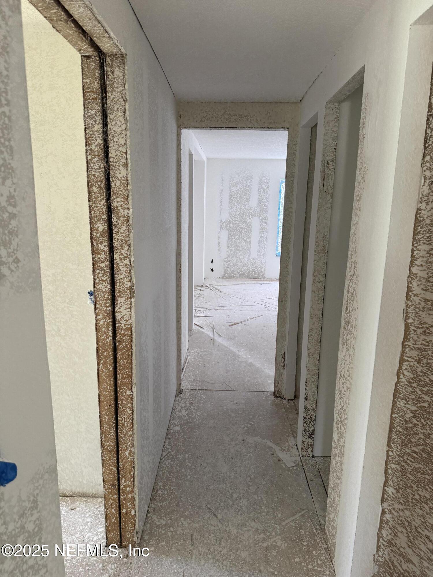 1193 Crum Street Starke, FL 32091 - Photo 8 of 10 a view of a hallway with a wooden door