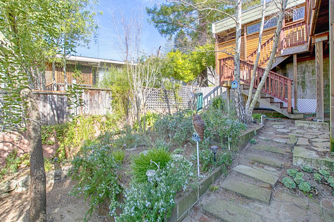 552 Bean Creek Road, Unit 57 Scotts Valley, CA 95066 - Photo 16 of 20 a backyard of a house with lots of green space