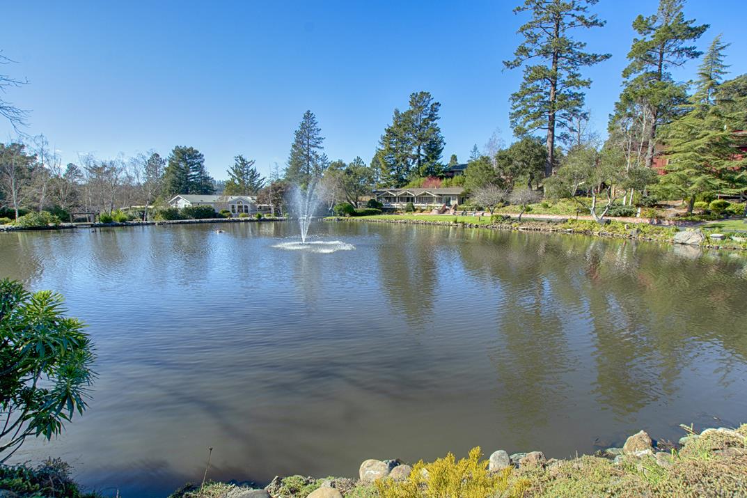 552 Bean Creek Road, Unit 57 Scotts Valley, CA 95066 - Photo 17 of 20 a view of a lake with a mountain in the background