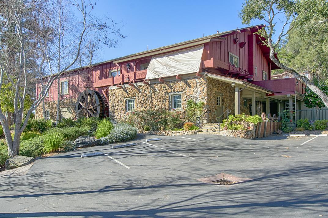 552 Bean Creek Road, Unit 57 Scotts Valley, CA 95066 - Photo 20 of 20 a view of a brick building with a bench in front of it