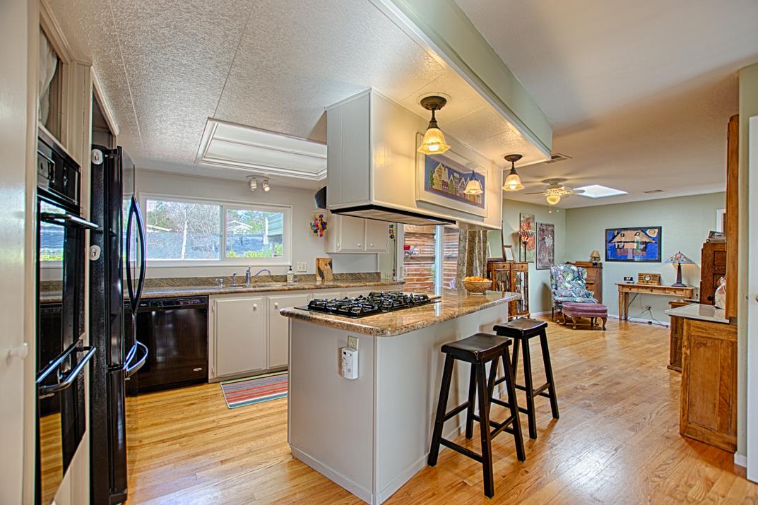 552 Bean Creek Road, Unit 57 Scotts Valley, CA 95066 - Photo 4 of 20 a kitchen with stainless steel appliances granite countertop a stove and cabinets