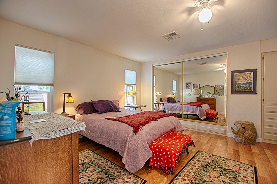 552 Bean Creek Road, Unit 57 Scotts Valley, CA 95066 - Photo 8 of 20 a bedroom with a bed and dresser