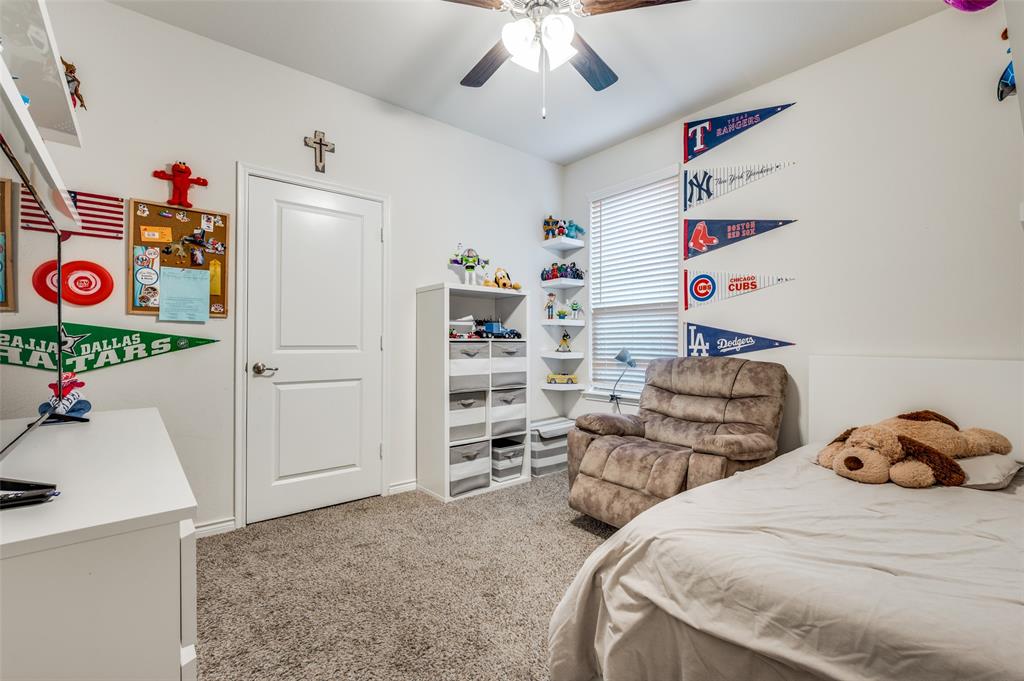 11105 Autry Ridge Lane Aubrey, TX 76227 - Photo 11 of 27 a bedroom with furniture and a window