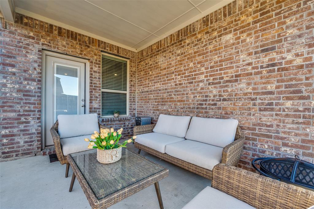 11105 Autry Ridge Lane Aubrey, TX 76227 - Photo 14 of 27 a view of a patio with couple of couch and a couch