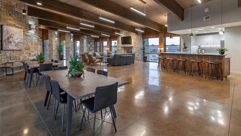 11105 Autry Ridge Lane Aubrey, TX 76227 - Photo 24 of 27 a kitchen with a table and chairs