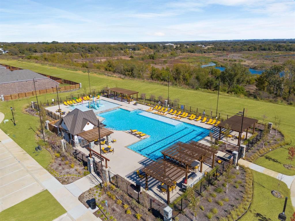 11105 Autry Ridge Lane Aubrey, TX 76227 - Photo 25 of 27 a view of a balcony with an ocean