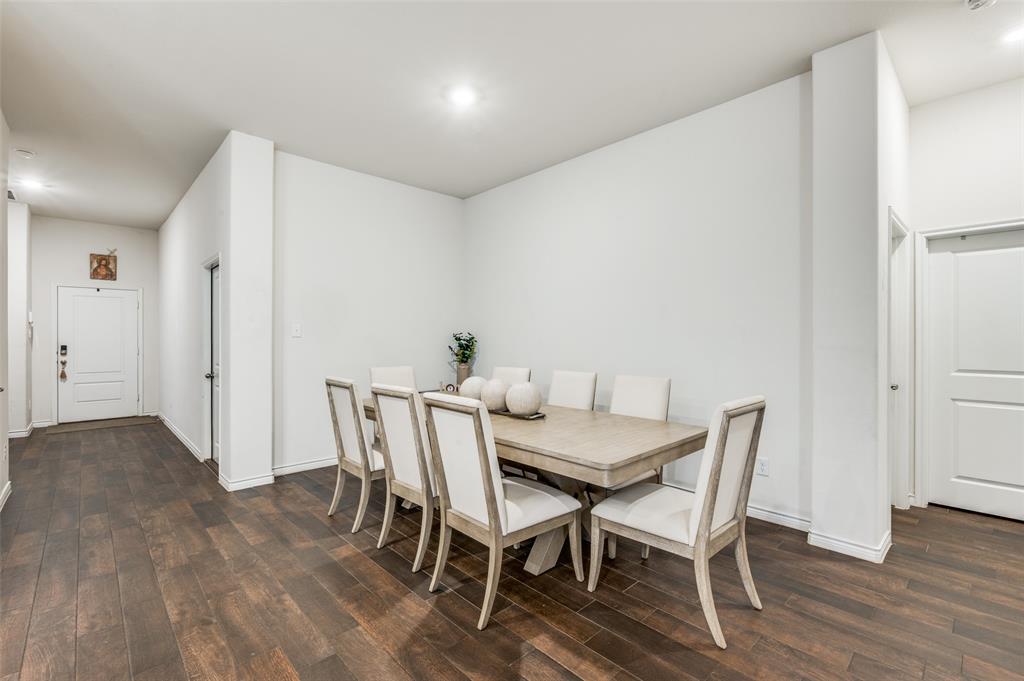 11105 Autry Ridge Lane Aubrey, TX 76227 - Photo 5 of 27 a view of a dining room with furniture and wooden floor