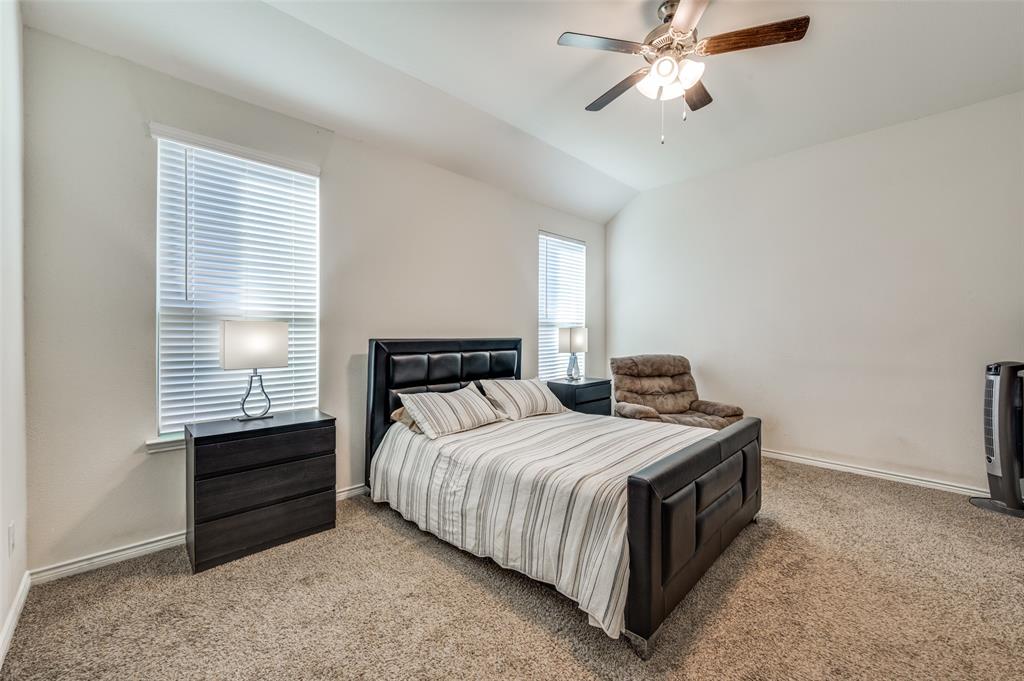 11105 Autry Ridge Lane Aubrey, TX 76227 - Photo 6 of 27 a bedroom with a bed and a window
