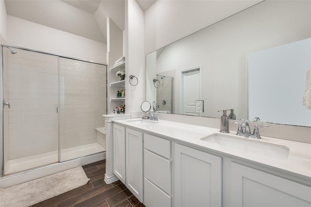 11105 Autry Ridge Lane Aubrey, TX 76227 - Photo 8 of 27 a bathroom with a double vanity sink mirror and shower