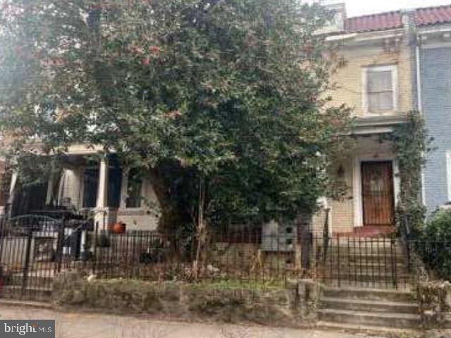 1522 Spring Place Northwest Washington, DC 20010 - Photo 4 of 4 a front view of a house with glass windows